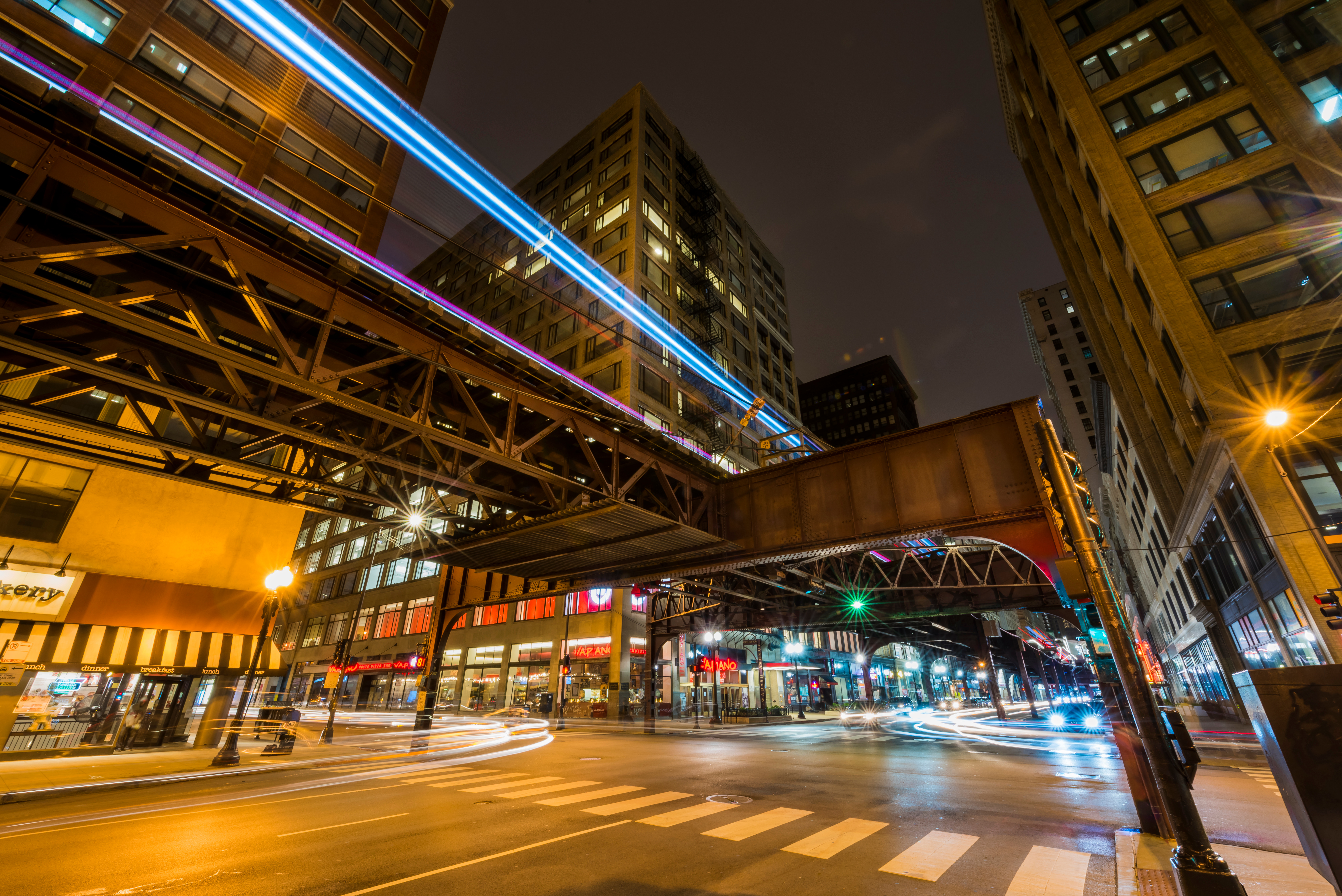 long exposure photo of taken at the corner of Wabash & Adams street outside the Palmer House Hilton in Chicago at night