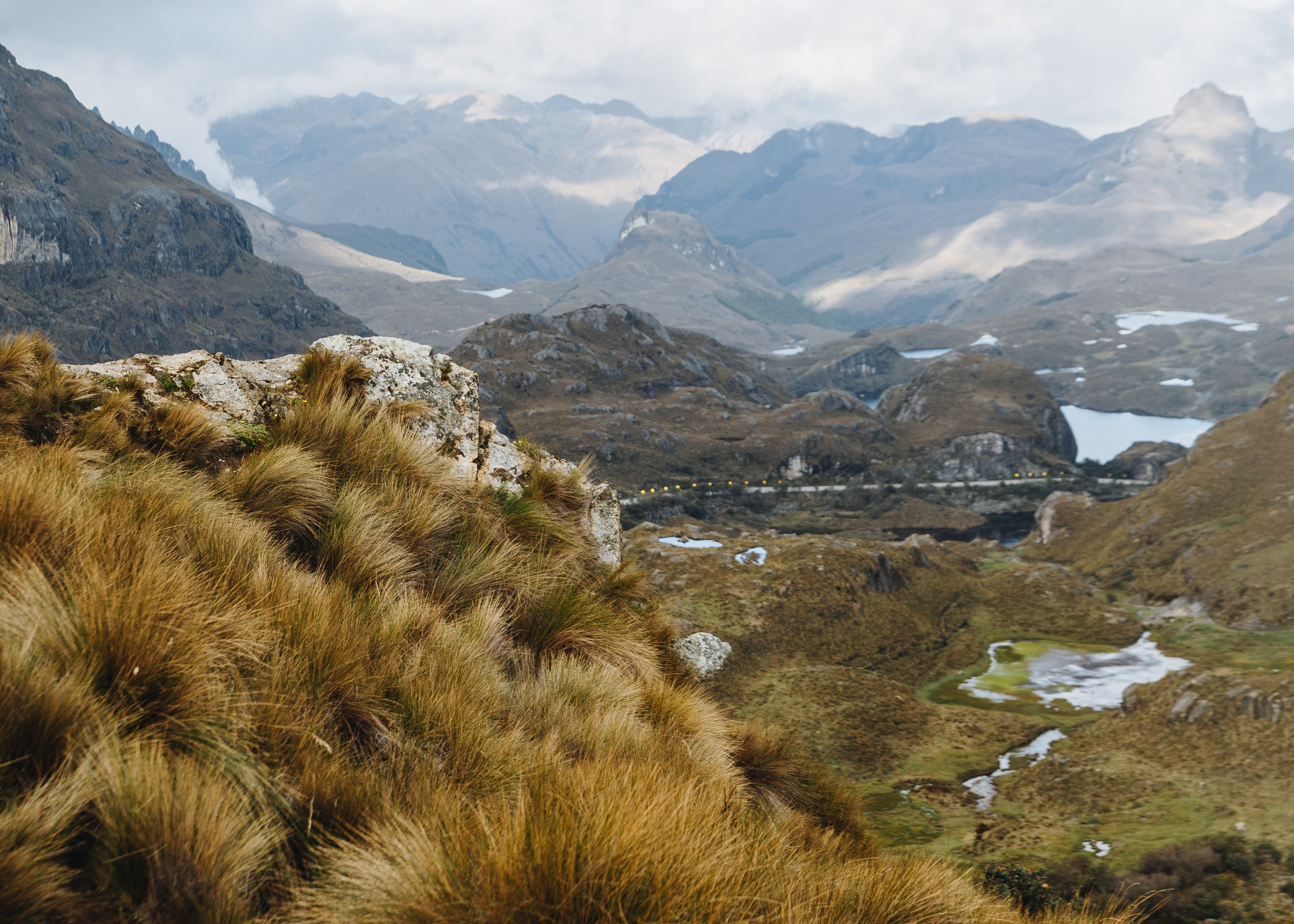 A lake at Cajas National Park with a mountain in the background