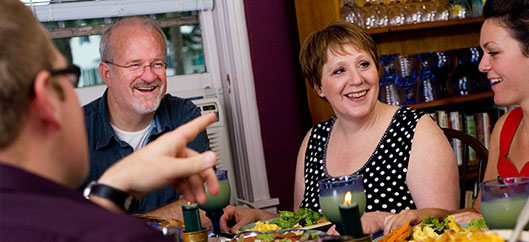 Susan Zork at dinner table with friends and family