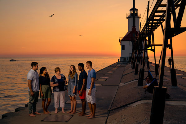 President Luxton chatting with Andrews students at the St. Joseph lighthouse pier